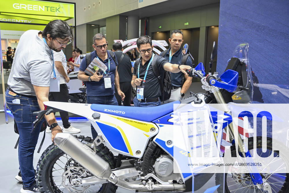 Overseas buyers look at motorcycles displayed by Chinese motorcycle brand Zhangxue Motorcycle (ZXMOTO) during the 140th China Import and Export Fair (Canton Fair) on October 15, 2026 in Guangzhou, Guangdong Province of China. The fair runs in three phases until November 4, covering a total exhibition area of 1.55 million square meters.