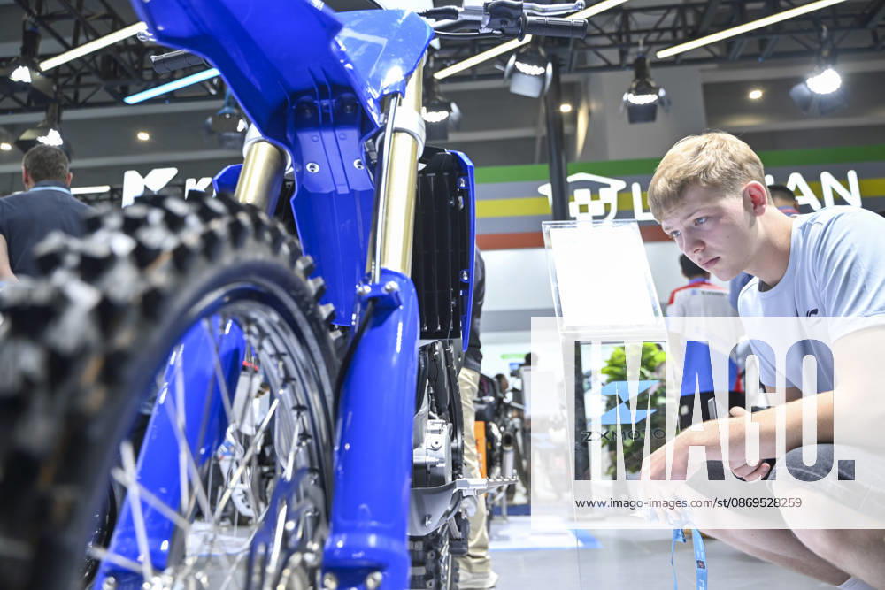 Overseas buyers look at motorcycles displayed by Chinese motorcycle brand Zhangxue Motorcycle (ZXMOTO) during the 140th China Import and Export Fair (Canton Fair) on October 15, 2026 in Guangzhou, Guangdong Province of China. The fair runs in three phases until November 4, covering a total exhibition area of 1.55 million square meters.