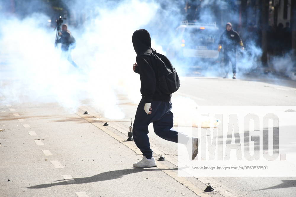 Student protests demanding improved educational conditions continue in Albania TIRANA, ALBANIA - OCTOBER 15: A protester runs through clouds of tear gas during clashes with police on the third day of demonstrations demanding improved educational conditions in Tirana, Albania, on October 15, 2026. University students are joined by high school students and local residents as police use tear gas to disperse demonstrators outside the Ministry of Education and the Parliament building, while protesters throw stones and other objects at police officers. Olsi Shehu Anadolu Tirana Albania. Editorial use only. Please get in touch for any other usage.