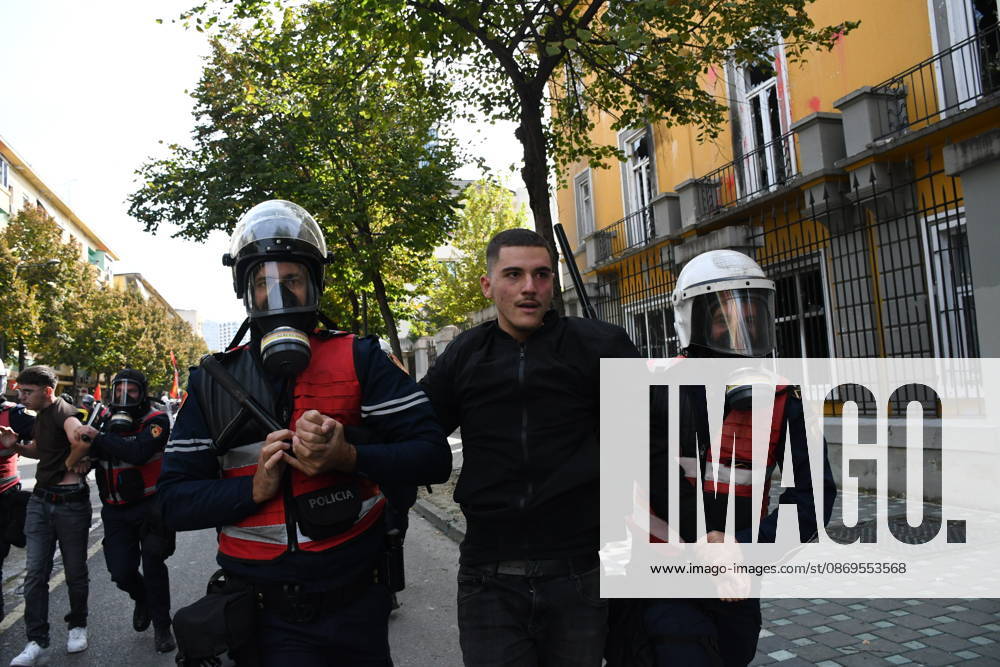 Student protests demanding improved educational conditions continue in Albania TIRANA, ALBANIA - OCTOBER 15: Riot police detain a protester during the third day of demonstrations demanding improved educational conditions in Tirana, Albania, on October 15, 2026. University students are joined by high school students and local residents as tensions escalate, with police using tear gas to disperse demonstrators outside the Ministry of Education and the Parliament building, while protesters throw stones and other objects at police officers. Olsi Shehu Anadolu Tirana Albania. Editorial use only. Please get in touch for any other usage.