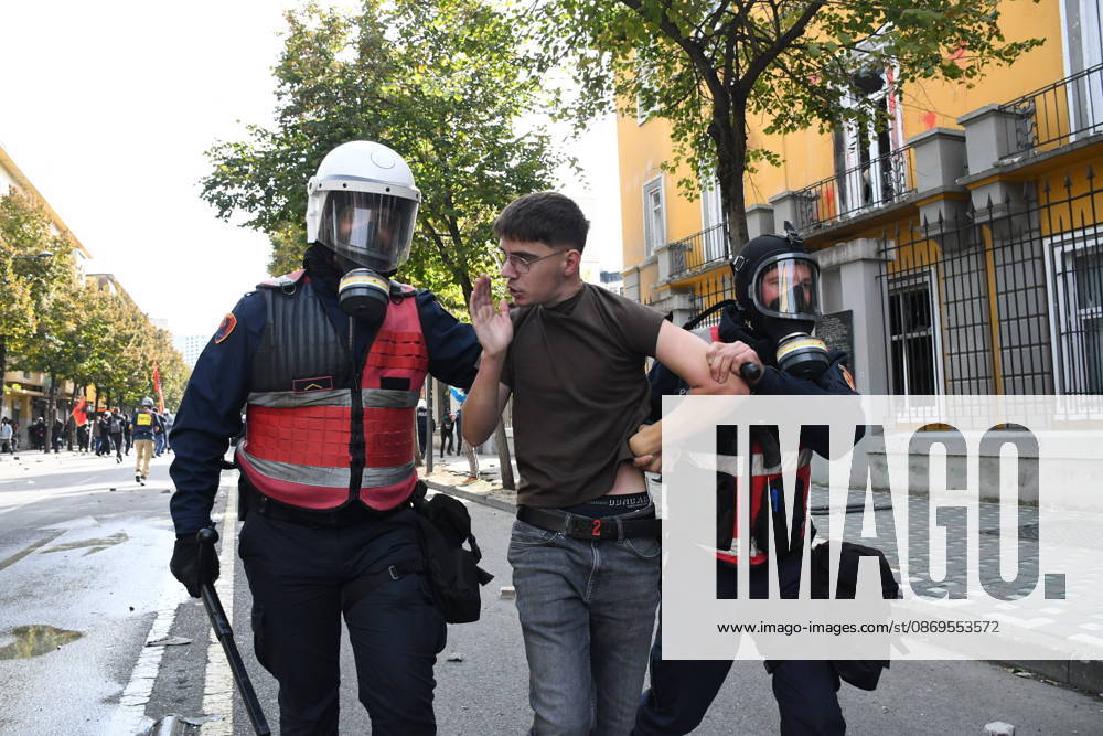 Student protests demanding improved educational conditions continue in Albania TIRANA, ALBANIA - OCTOBER 15: Riot police detain a protester during the third day of demonstrations demanding improved educational conditions in Tirana, Albania, on October 15, 2026. University students are joined by high school students and local residents as tensions escalate, with police using tear gas to disperse demonstrators outside the Ministry of Education and the Parliament building, while protesters throw stones and other objects at police officers. Olsi Shehu Anadolu Tirana Albania. Editorial use only. Please get in touch for any other usage.