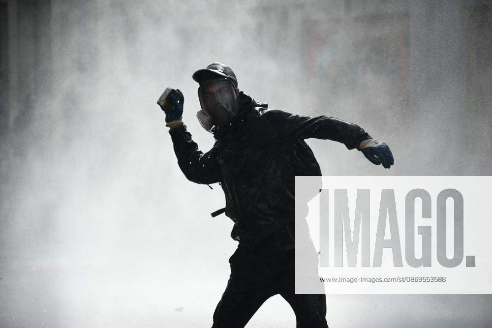 Student protests demanding improved educational conditions continue in Albania TIRANA, ALBANIA - OCTOBER 15: A protester, wearing a gas mask, moves through a cloud of water sprayed by a police water cannon during the third day of demonstrations demanding improved educational conditions in Tirana, Albania, on October 15, 2026. University students are joined by high school students and local residents as tensions escalate, with police using tear gas to disperse demonstrators outside the Ministry of Education and the Parliament building, while protesters throw stones and other objects at police officers. Olsi Shehu Anadolu Tirana Albania. Editorial use only. Please get in touch for any other usage.