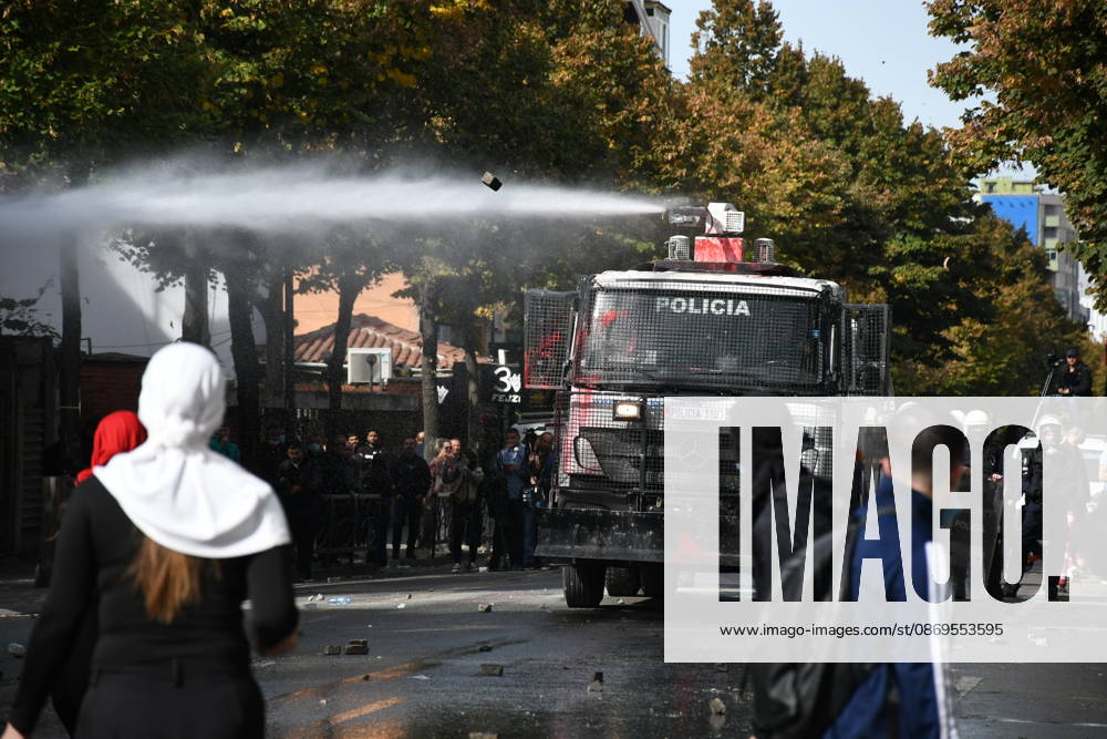 Student protests demanding improved educational conditions continue in Albania TIRANA, ALBANIA - OCTOBER 15: A police water cannon sprays water toward demonstrators during the third day of protests demanding improved educational conditions in Tirana, Albania, on October 15, 2026. University students are joined by high school students and local residents as tensions escalate, with police using tear gas to disperse demonstrators outside the Ministry of Education and the Parliament building, while protesters throw stones and other objects at police officers. Olsi Shehu Anadolu Tirana Albania. Editorial use only. Please get in touch for any other usage.
