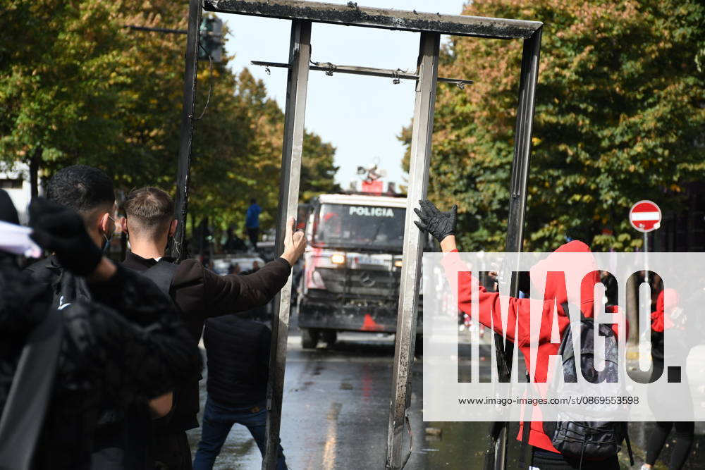 Student protests demanding improved educational conditions continue in Albania TIRANA, ALBANIA - OCTOBER 15: Protesters hold up a large metal frame as a police water cannon vehicle approaches during the third day of demonstrations demanding improved educational conditions in Tirana, Albania, on October 15, 2026. University students are joined by high school students and local residents as tensions escalate, with police using tear gas to disperse demonstrators outside the Ministry of Education and the Parliament building, while protesters throw stones and other objects at police officers. Olsi Shehu Anadolu Tirana Albania. Editorial use only. Please get in touch for any other usage.