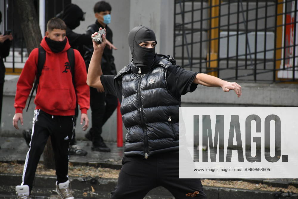 Student protests demanding improved educational conditions continue in Albania TIRANA, ALBANIA - OCTOBER 15: A masked protester prepares to throw a stone during clashes with police on the third day of demonstrations demanding improved educational conditions in Tirana, Albania, on October 15, 2026. University students are joined by high school students and local residents as tensions escalate, with police using tear gas to disperse demonstrators outside the Ministry of Education and the Parliament building, while protesters throw stones and other objects at police officers. Olsi Shehu Anadolu Tirana Albania. Editorial use only. Please get in touch for any other usage.