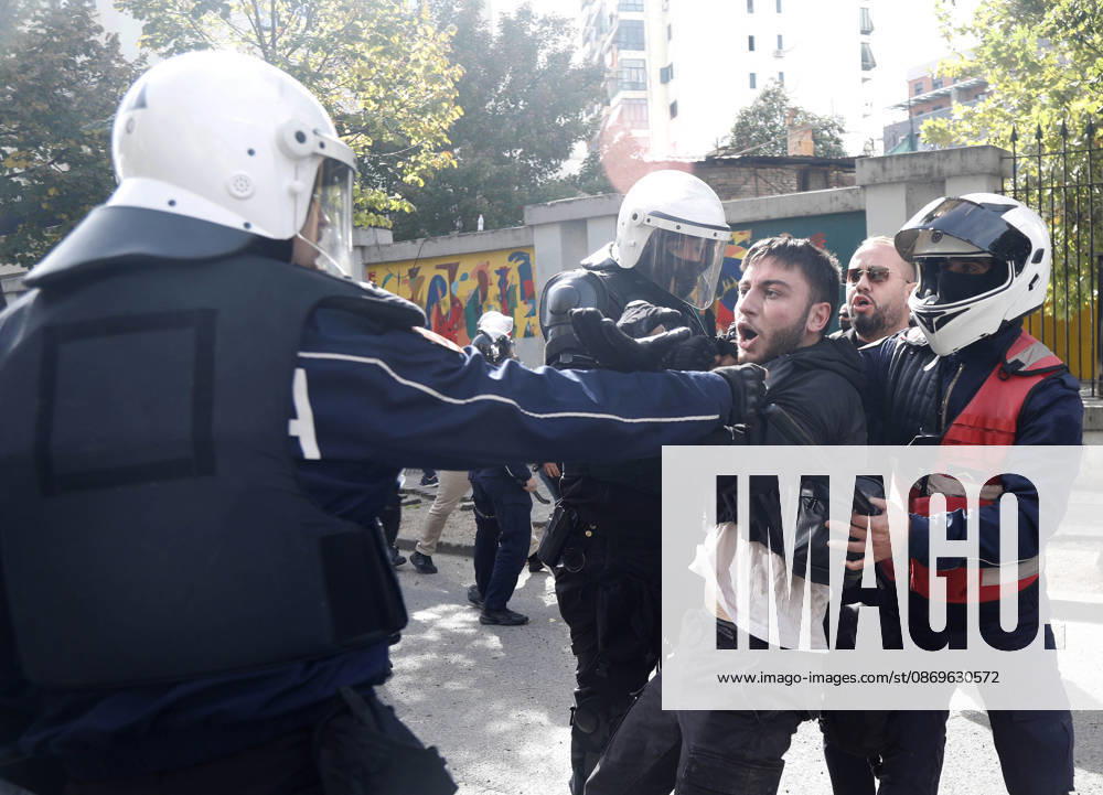 Protesters Clash with Police During a Demonstration in Tirana, Albania. Riot police detain a protester during an anti-government demonstration in central Tirana on October 15, 2026, as protests continued for a third consecutive day over university conditions and demands for the resignation of Albanian Prime Minister Edi Rama. The latest rally follows two nights of violence in the capital, during which protesters and riot police clashed, police used water cannons and tear gas, and demonstrators damaged government offices and shops and set fire to several buildings. Light Studio Agency Malton Dibra Tirana Albania