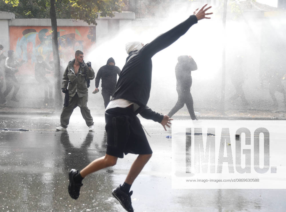Protesters Clash with Police During a Demonstration in Tirana, Albania. Protesters throw stones at riot police during an anti-government demonstration in central Tirana on October 15, 2026, as protests continued for a third consecutive day over university conditions and demands for the resignation of Albanian Prime Minister Edi Rama. The latest rally follows two nights of violence in the capital, during which protesters and riot police clashed, police used water cannons and tear gas, and demonstrators damaged government offices and shops and set fire to several buildings. Light Studio Agency Malton Dibra Tirana Albania