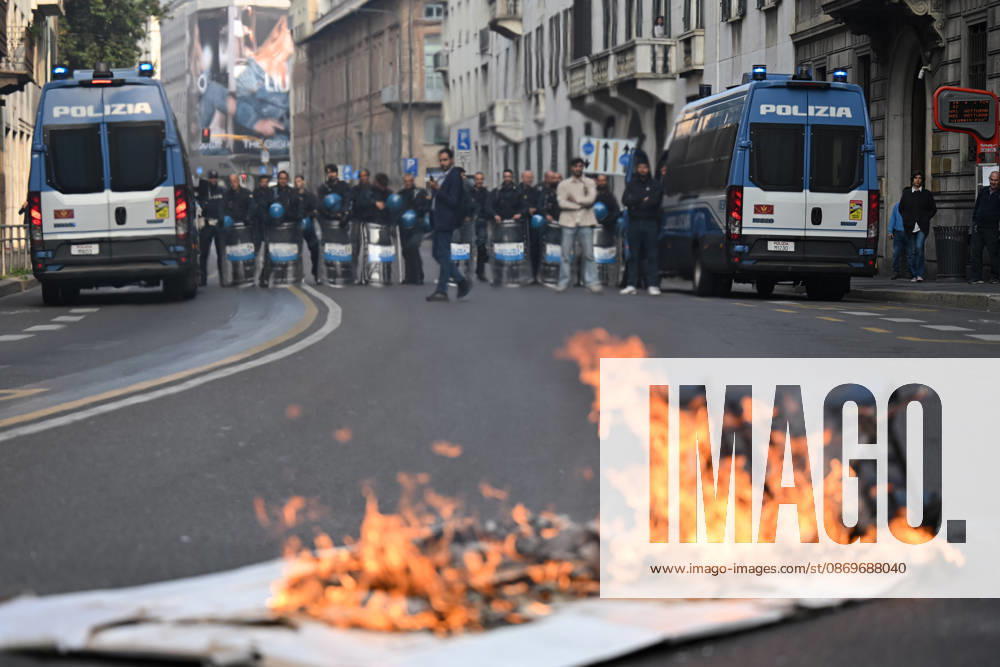 Nationwide school strike in Milan MILAN, ITALY - OCTOBER 16: Police officers look at a banner on fire during a nationwide school strike in Milan, Italy, on October 16, 2026. Protesters oppose the government s education policies and measures they consider discriminatory towards students of foreign origin, also highlighting demands for higher wages and an end to precarious employment in schools. Piero Cruciatti Anadolu Milan Italy. Editorial use only. Please get in touch for any other usage.