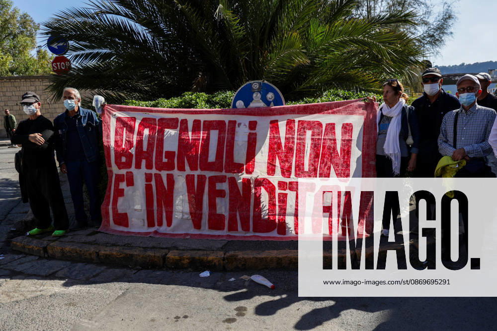 IPA89763005 - NAPLES, ITALY — OCTOBER 16, 2026: Environmental activists, students, and unemployed people take to the streets in the Bagnoli district of Naples to protest the city government’s handling of the environmental remediation of the former Italsider steelworks site. The demonstration focuses on the ongoing redevelopment work in the area, where facilities for the 38th Louis Vuitton America’s Cup—scheduled to take place in Naples in 2027—are being built. Protesters raise concerns about environmental protection, the remediation process, and the project’s impact on the local community.