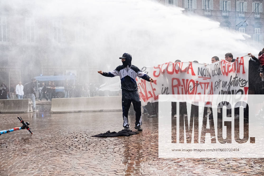 IPA89764434 - Police use water cannons against protesters in Piazza Castello during a student strike in Turin; Report from Turin, Italy