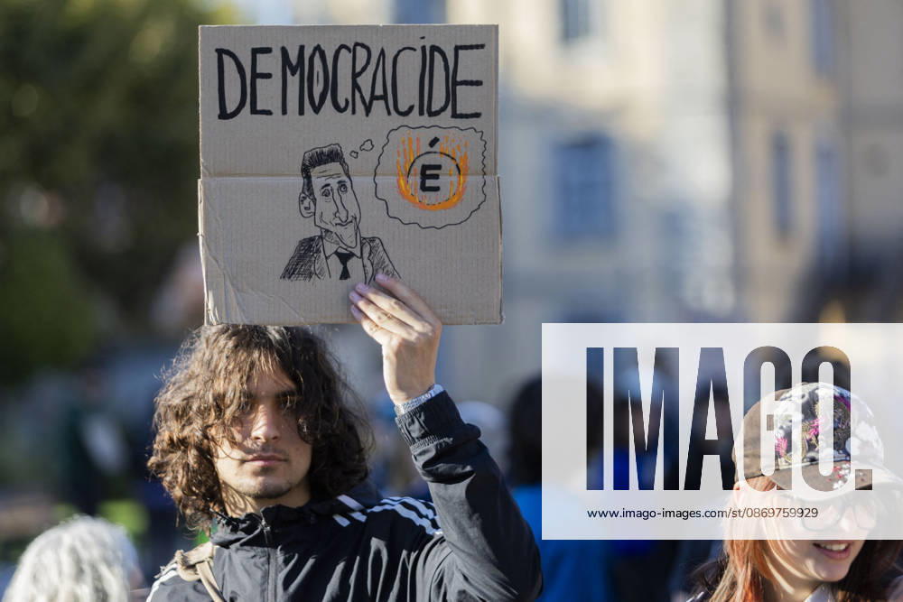 High Cost of Living Protest - Gap A demonstrator holds a placard reading Démocracide during the march in Gap, France, on October 17, 2026. Photo by Thibaut Durand ABACAPRESS.COM Gap Provence-Alpes-Cote d Azur France