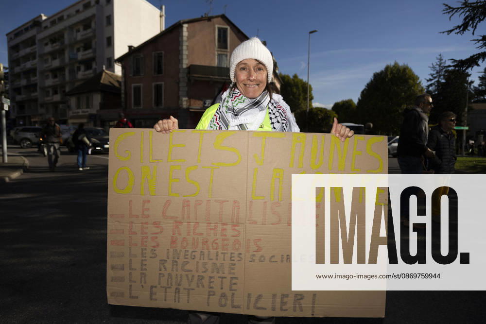 High Cost of Living Protest - Gap A demonstrator in a yellow vest holds a large handwritten placard during the march in Gap, France, on October 17, 2026. Its headline calls for Gilets jaunes to stand against capitalism; the smaller wording is not fully legible. Photo by Thibaut Durand ABACAPRESS.COM Gap Provence-Alpes-Cote d Azur France