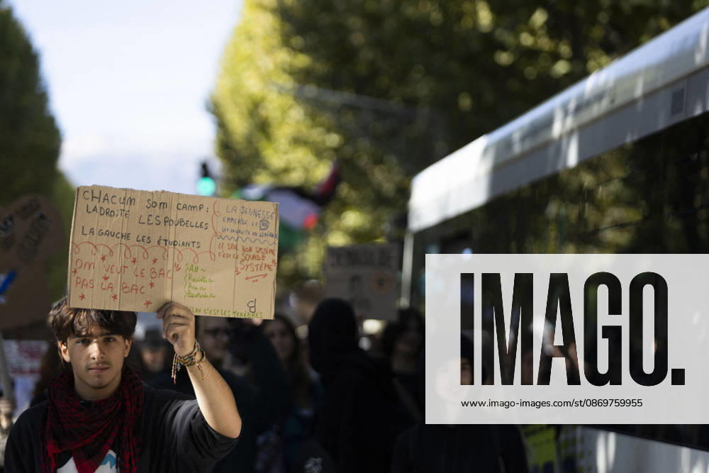 High Cost of Living Protest - Gap A young demonstrator holds a handwritten cardboard sign above the march in Gap, France, on October 17, 2026. The wording is partly obscured and cannot be transcribed reliably. Photo by Thibaut Durand ABACAPRESS.COM Gap Provence-Alpes-Cote d Azur France