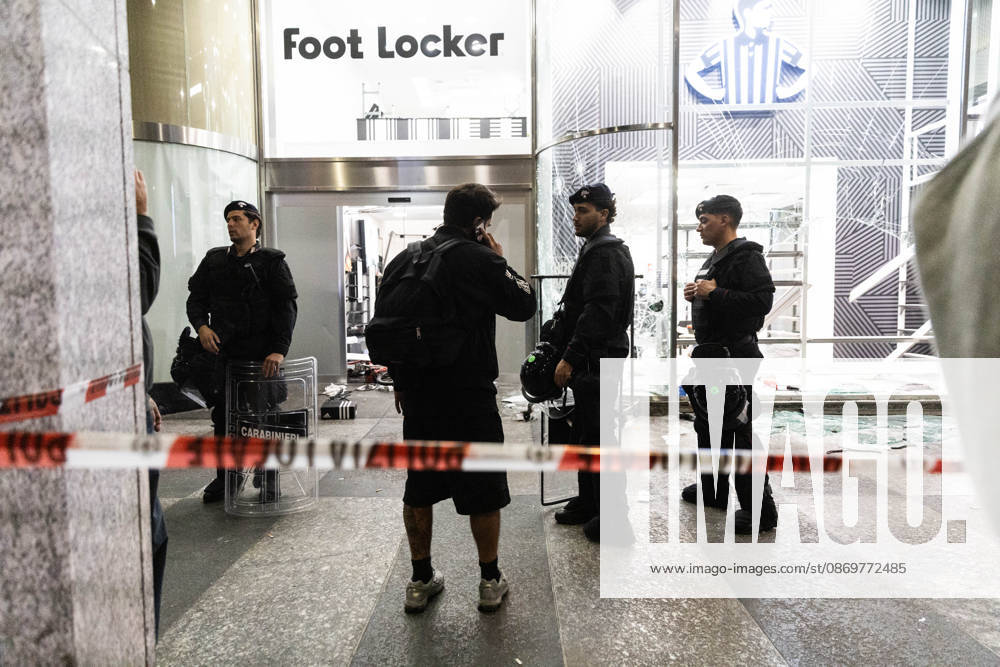 IPA89820333 - Milan, October 17, 2026, Corso Vittorio Emanuele: Photos of the damage following clashes at the protest against the high cost of living: The Foot Locker store was looted and its window shattered