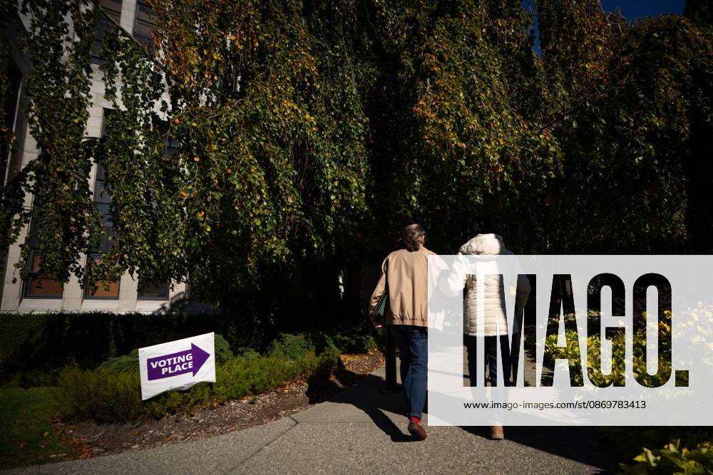 People walk past a sign directing to a polling station in Vancouver, on Saturday Oct. 17, 2026. British Columbians are heading to the polls to cast their votes in municipal elections being held across the province. Port Moody CANADA - ZUMAc35_ 20261017_zaf_c35_017