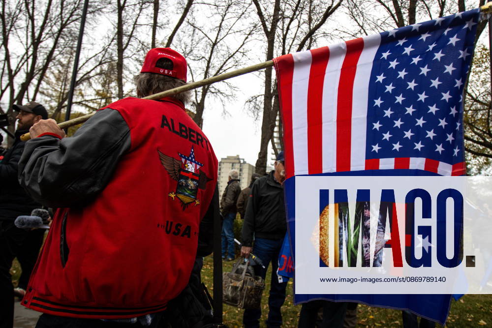 An attendee carries a flag at an Alberta independence rally at the Alberta legislature, in Edmonton on Saturday, Oct. 17, 2026. Edmonton Canada - ZUMAc35_ 20261017_zaf_c35_032