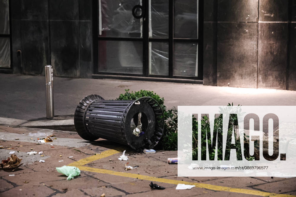 IPA89830557 - Milan: Damage caused by clashes between protesters and police during the Italia in Piazza demonstration against the high cost of living in the city center. Pictured: Damage on Missori Street