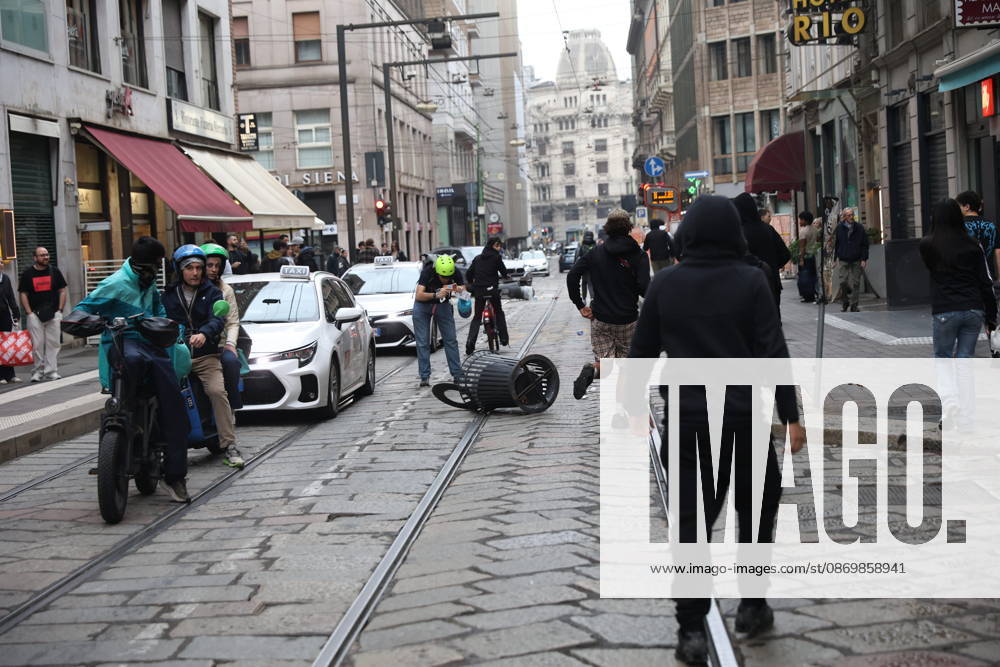 IPA89860594 - Milan: Clashes and looting by hooded youths continued in the city center the day after the demonstration on Saturday, the 17th; many hooded individuals were detained and taken to police headquarters.