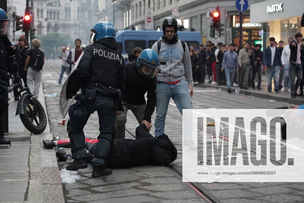 IPA89866441 - Milan: Clashes and looting by hooded youths continued in the city center the day after the demonstration on Saturday, the 17th; many hooded individuals were detained and taken to police headquarters.