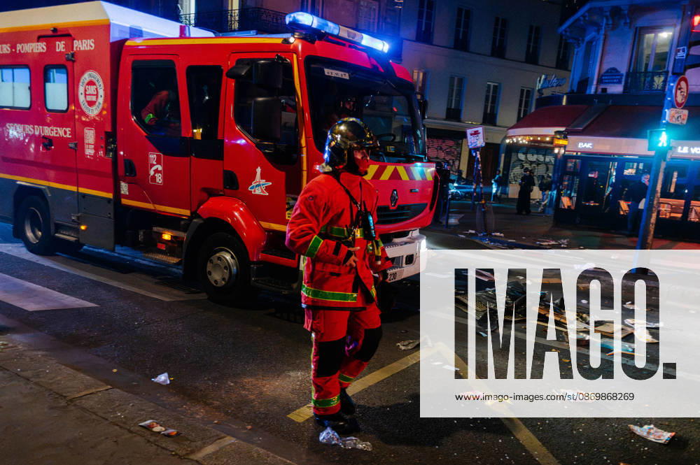 Firefighters are on the scene to extinguish one of the many fires in the streets of Paris. Protesters gathered at Place de la RÃ publique the day after the demonstration on 17 October; the police used tear gas and water cannons to disperse them. Many found themselves in the surrounding streets. - 18 10 2026 - France Paris Paris - JanxSchmidt-Whitley LexPictorium LePictorium_0344291