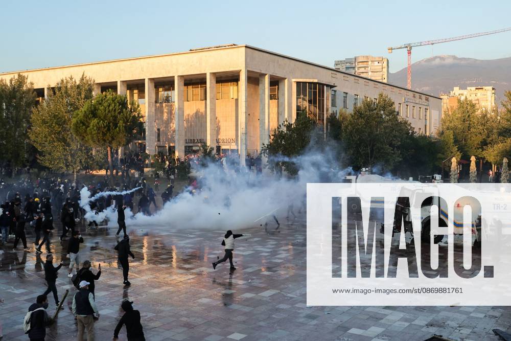 TIRANA, ALBANIA, OCTOBER 18, 2026: Demonstrators clash with riot police in Skanderbeg Square as student-led anti-government protests continue for a sixth consecutive day. Confrontations spread from the Ministry of Education to central Tirana, with protesters throwing stones and pyrotechnics while police deploy tear gas and water cannons. Demonstrators demand improved university conditions and the resignation of Prime Minister Edi Rama. Tirana Albania - ZUMAq101 20261018_zna_q101_221