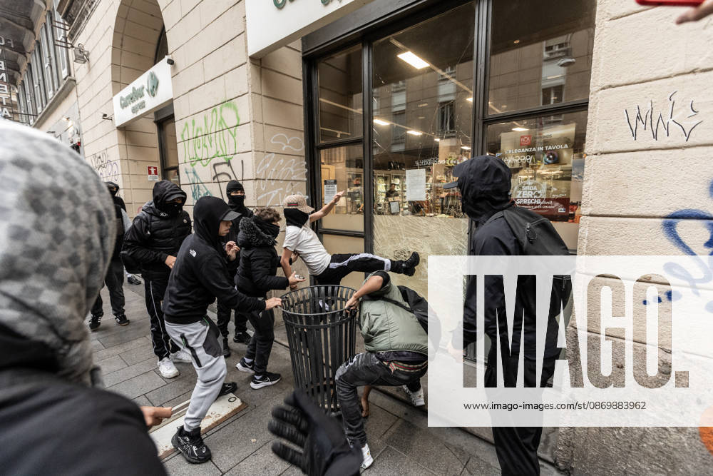 Police detain 160 as unrest continues for second day in Milan MILAN, ITALY - OCTOBER 18: Protesters vandalize a shop during protests in Milan, Italy, on October 18, 2026. Groups threw stones, bottles, firecrackers and barriers at police officers, who responded with tear gas and water cannon, while shops were damaged and looted around the city center and a Carabinieri vehicle was destroyed. Andrea Carrubba Anadolu Milan Italy. Editorial use only. Please get in touch for any other usage.
