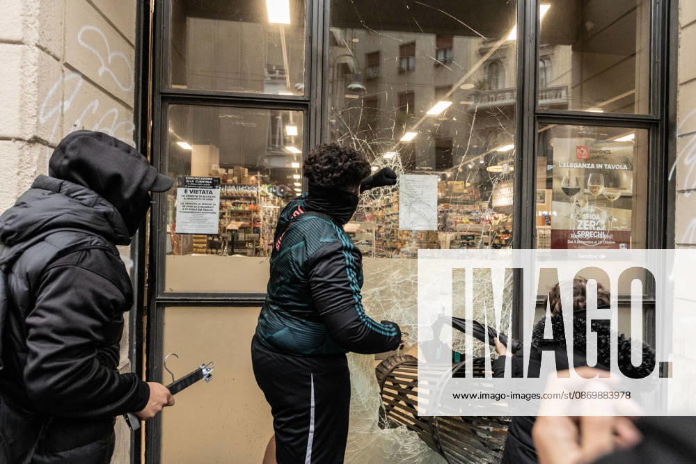 Police detain 160 as unrest continues for second day in Milan MILAN, ITALY - OCTOBER 18: Protesters vandalize a shop during protests in Milan, Italy, on October 18, 2026. Groups threw stones, bottles, firecrackers and barriers at police officers, who responded with tear gas and water cannon, while shops were damaged and looted around the city center and a Carabinieri vehicle was destroyed. Andrea Carrubba Anadolu Milan Italy. Editorial use only. Please get in touch for any other usage.