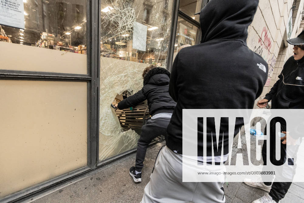 Police detain 160 as unrest continues for second day in Milan MILAN, ITALY - OCTOBER 18: Protesters vandalize a shop during protests in Milan, Italy, on October 18, 2026. Groups threw stones, bottles, firecrackers and barriers at police officers, who responded with tear gas and water cannon, while shops were damaged and looted around the city center and a Carabinieri vehicle was destroyed. Andrea Carrubba Anadolu Milan Italy. Editorial use only. Please get in touch for any other usage.