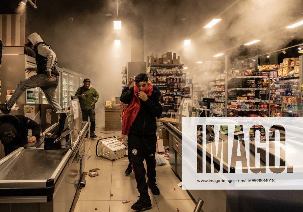Police detain 160 as unrest continues for second day in Milan MILAN, ITALY - OCTOBER 18: Protesters vandalize a shop during protests in Milan, Italy, on October 18, 2026. Groups threw stones, bottles, firecrackers and barriers at police officers, who responded with tear gas and water cannon, while shops were damaged and looted around the city center and a Carabinieri vehicle was destroyed. Andrea Carrubba Anadolu Milan Italy. Editorial use only. Please get in touch for any other usage.