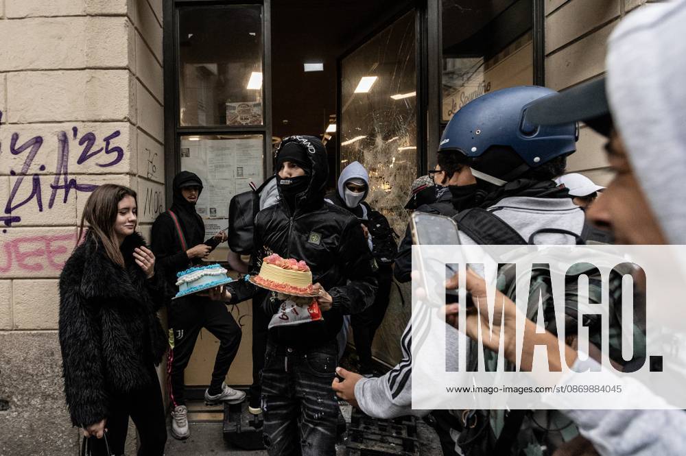 Police detain 160 as unrest continues for second day in Milan MILAN, ITALY - OCTOBER 18: Protesters vandalize a shop during protests in Milan, Italy, on October 18, 2026. Groups threw stones, bottles, firecrackers and barriers at police officers, who responded with tear gas and water cannon, while shops were damaged and looted around the city center and a Carabinieri vehicle was destroyed. Andrea Carrubba Anadolu Milan Italy. Editorial use only. Please get in touch for any other usage.