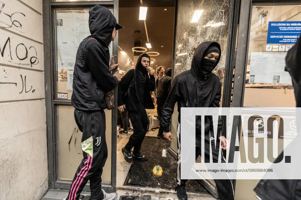 Police detain 160 as unrest continues for second day in Milan MILAN, ITALY - OCTOBER 18: Protesters vandalize a shop during protests in Milan, Italy, on October 18, 2026. Groups threw stones, bottles, firecrackers and barriers at police officers, who responded with tear gas and water cannon, while shops were damaged and looted around the city center and a Carabinieri vehicle was destroyed. Andrea Carrubba Anadolu Milan Italy. Editorial use only. Please get in touch for any other usage.