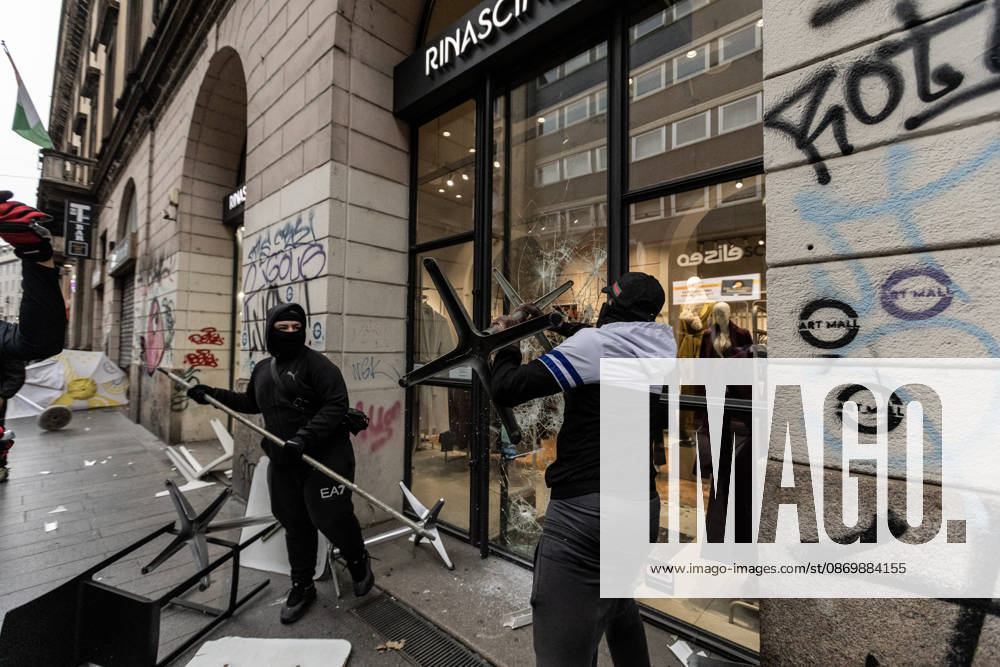 Police detain 160 as unrest continues for second day in Milan MILAN, ITALY - OCTOBER 18: Protesters vandalize a shop during protests in Milan, Italy, on October 18, 2026. Groups threw stones, bottles, firecrackers and barriers at police officers, who responded with tear gas and water cannon, while shops were damaged and looted around the city center and a Carabinieri vehicle was destroyed. Andrea Carrubba Anadolu Milan Italy. Editorial use only. Please get in touch for any other usage.