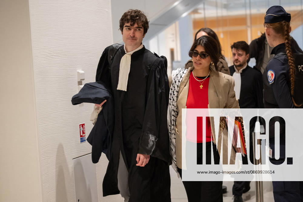 Rima Hassan Trial - Paris AJ www.alexisjumeau.comMEP Rima Hassan, wearing a keffiyeh draped over her shoulders (a symbol of the Palestinian people’s struggle), accompanied by her lawyer, Maitre Vincent Brengarth, walks towards the courtroom, Trial of Rima Hassan, MEP for the La France Insoumise (LFI) movement (a left-wing opposition political party), on charges of glorifying terrorism following a tweet featuring a photograph of Kozo Okamoto repeating a message about the need for armed struggle for the Palestinian cause and Palestine’s war with Israel, in the courtroom of the Paris Criminal Court, France on October 19, 2026. Photo by Alexis Jumeau ABACAPRESS.COM Paris France