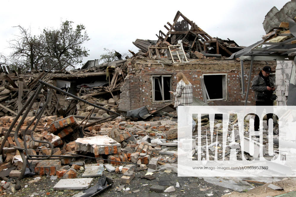 A man and a woman stand among the rubble near a house damaged by a Russian bombardment in Dnipro, Ukraine, October 19, 2026. On Monday morning, Russian forces launched guided aerial bombs at the eastern city, damaging private homes and infrastructure. An 84-year-old woman was hospitalised in moderate condition. (Photo by Mykola Miakshykov Ukrinform) Russian troops hit Dnipro with guided bombs
