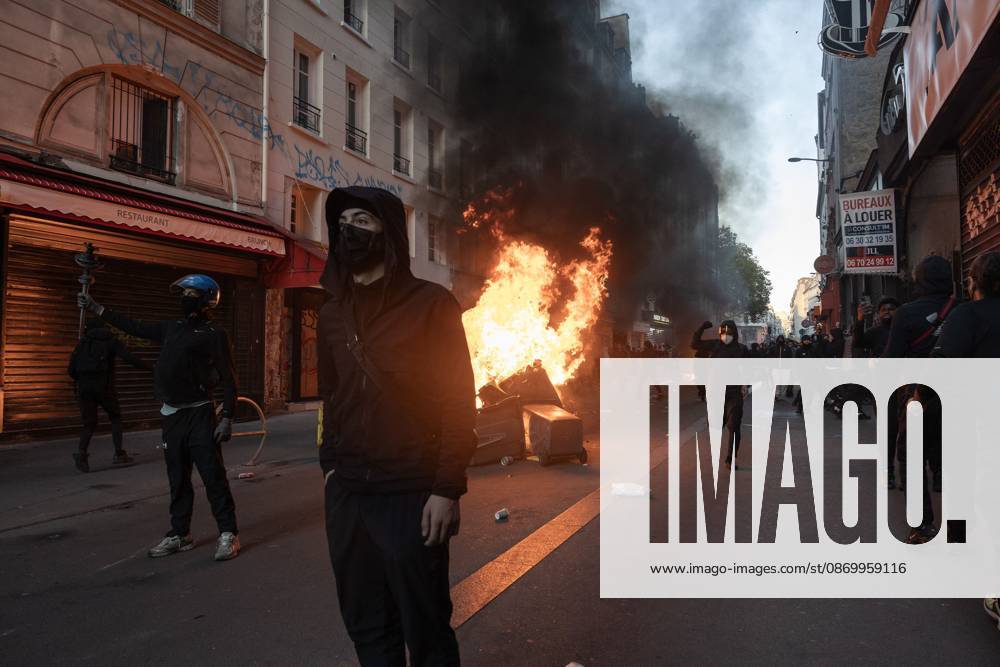 PARIS, FRANCE - OCTOBER 18, 2026: Protesters clash with police near Place de la RÃ publique in Paris during a protest against austerity. Protesters set up makeshift barricades and start fires in the square and surrounding streets. After police clear the square, protesters attack nearby shops. Paris France - ZUMAq101 20261018_zna_q101_291