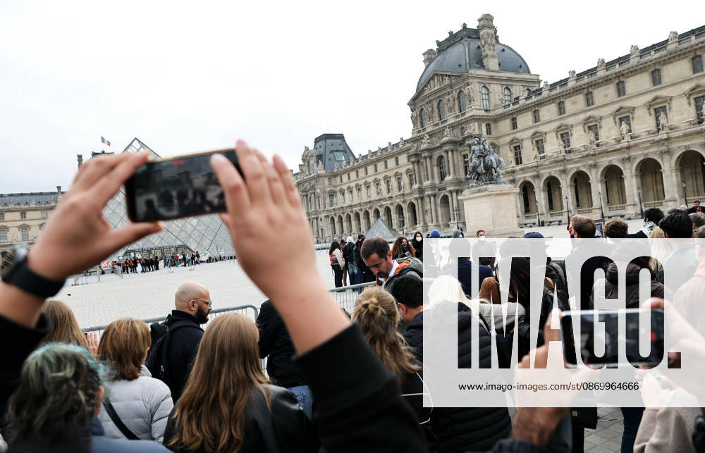 (261019) -- PARIS, Oct. 19, 2026 -- Tourists gather in front of the Louvre Museum in Paris, France, Oct. 19, 2026. In Paris, the entrance to the Louvre Museum was blocked by student protesters on Monday morning, French daily Le Parisien reported, citing the museum s management and two trade unions. According to the trade union General Confederation of Labour, the museum would remain closed at least until noon. ) FRANCE-PARIS-LOUVRE MUSEUM-PROTEST WuxHuiwo