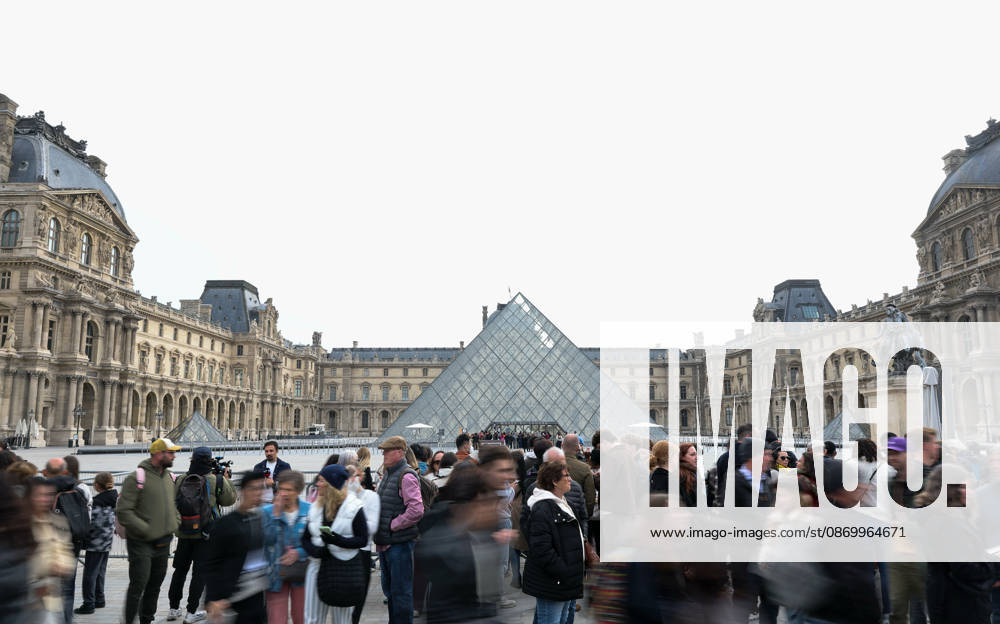 (261019) -- PARIS, Oct. 19, 2026 -- Tourists gather in front of the Louvre Museum in Paris, France, Oct. 19, 2026. In Paris, the entrance to the Louvre Museum was blocked by student protesters on Monday morning, French daily Le Parisien reported, citing the museum s management and two trade unions. According to the trade union General Confederation of Labour, the museum would remain closed at least until noon. ) FRANCE-PARIS-LOUVRE MUSEUM-PROTEST WuxHuiwo