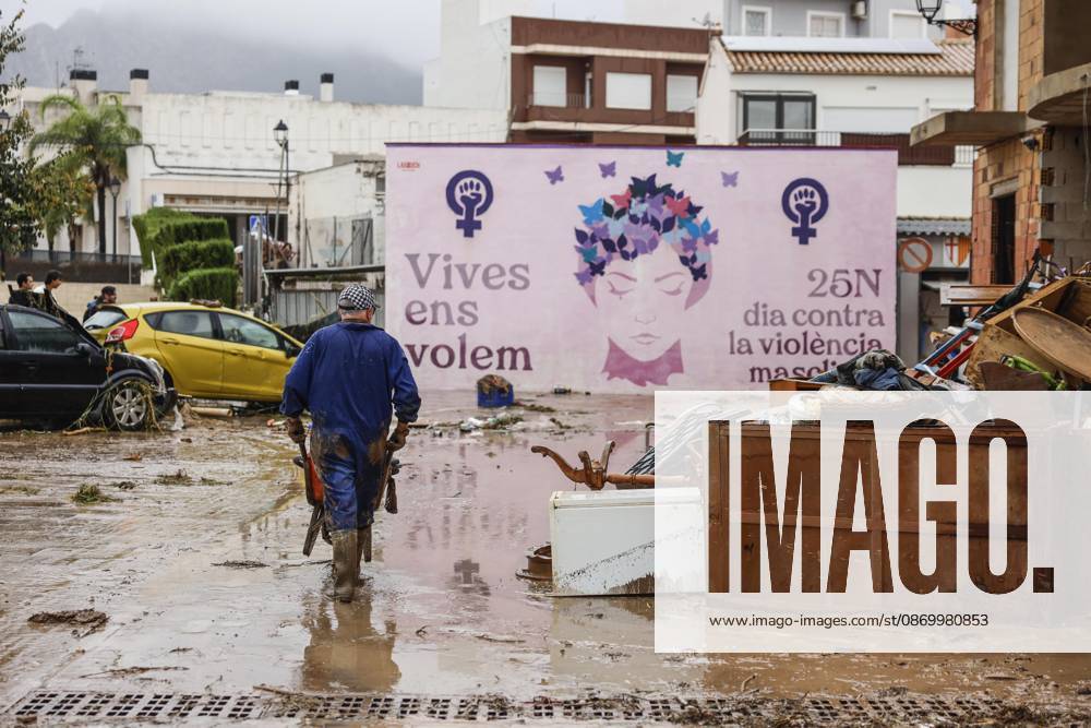 The Valencian Regional Government is preparing a lockdown order for the southern coast of Valencia and the northern coast of Alicante due to the rains. Several people are clearing mud from the streets while furniture they had to remove due to flooding caused by the heavy rains piles up, on October 19, 2026, in Els Poblets, Valencian Community, Spain. The Valencian Regional Government is preparing a lockdown order for the southern coast of Valencia and the northern coast of Alicante in response to the emergency declared due to the rains brought by Storm Adam, as announced by the Regional Minister of Emergencies and the Interior early this morning, October 19, from the Emergency Coordination Center (CCE) October 19, 2026, Valencia, Valencian