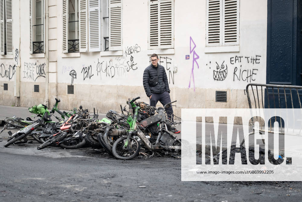 Shops Looted After the October 17th Demonstration - Paris AJ This photo shows a passerby looking at bicycles that have been charred, burned, and destroyed on October 19, 2026 two days after riots and looting occurred (pillage) on the sidelines of nationwide cost-of-living demonstrations. Photo by Alexis Jumeau ABACAPRESS.COM Paris France