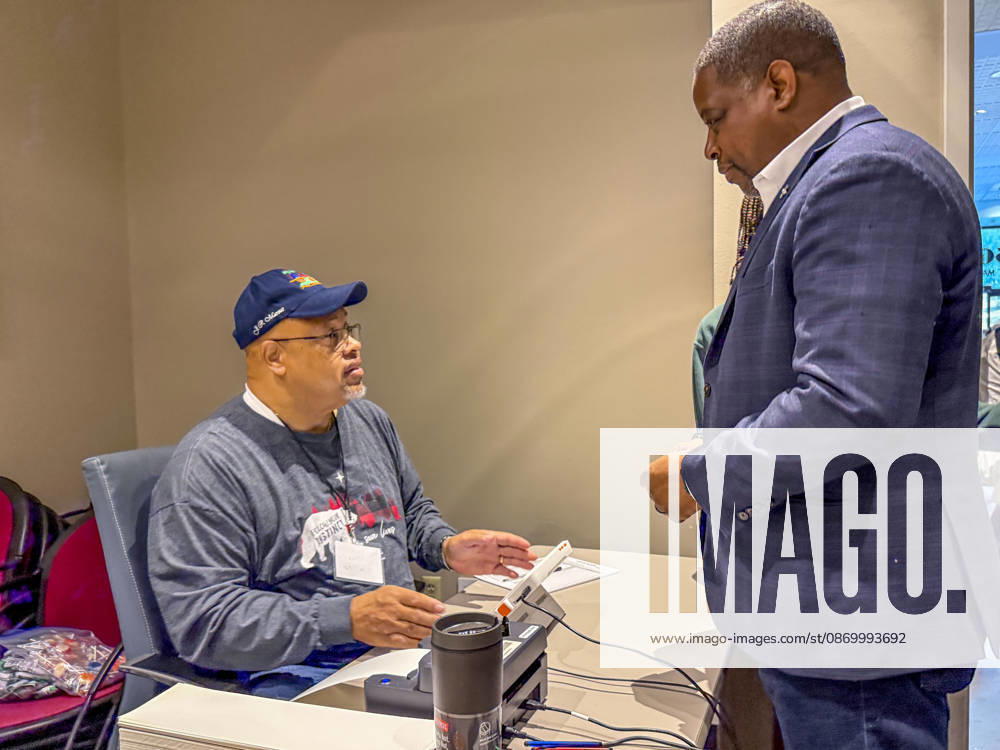 Poll worker JERRY SAXTON checks in Democratic Congressional candidate CHRIS JONES so he can cast his ballot on the first day of early vote in Arkansas. Jones is running for the seat now held by Rep. French Hill (R-AR). Should Jones win, he will be the first Black person Arkansas sends to Congress. Little Rock USA - ZUMAd155 20261019_znp_d155_025