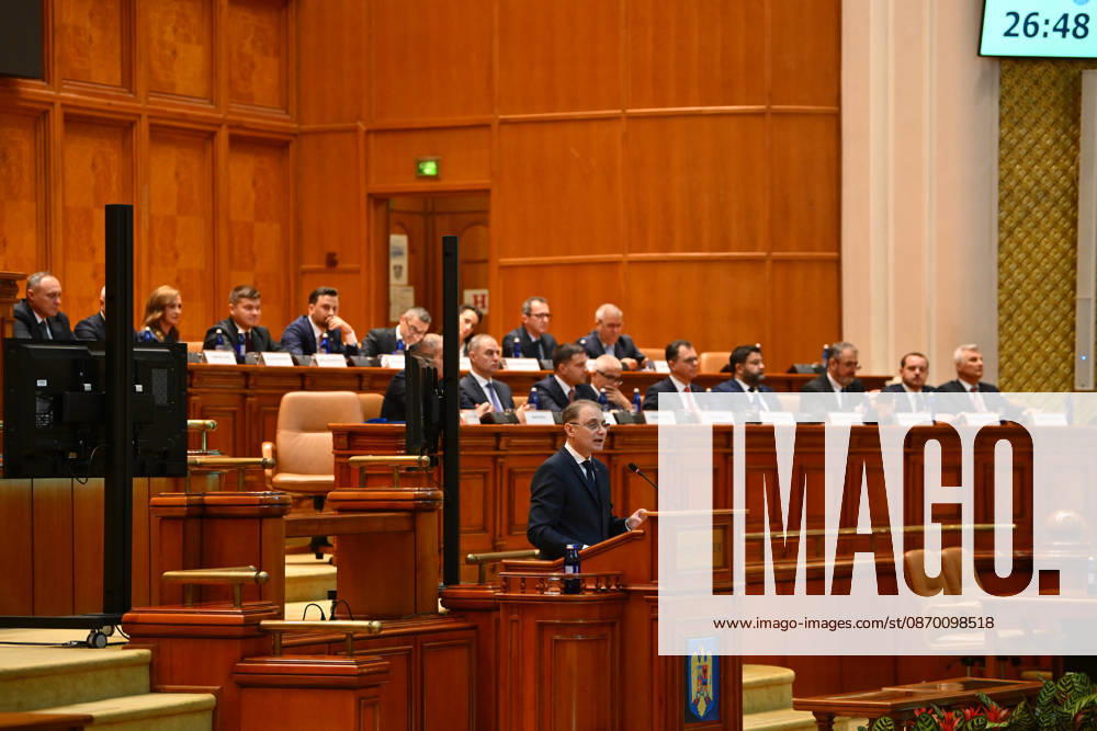 Prime Minister-designate Luca Niculescu addresses plenary session of the Romanian Parliament in Bucharest BUCHAREST, ROMANIA - OCTOBER 20: Prime Minister-designate Luca Niculescu, proposed by President of Romania Nicusor Dan, addresses a joint plenary session of the Romanian Parliament at the Palace of the Parliament in Bucharest, Romania on Tuesday, October 20, 2026. Niculescu presented his governing platform, fiscal reform agenda, and proposed cabinet lineup to lawmakers ahead of the vote of confidence. Alex Nicodim Anadolu Bucharest Romania. Editorial use only. Please get in touch for any other usage.