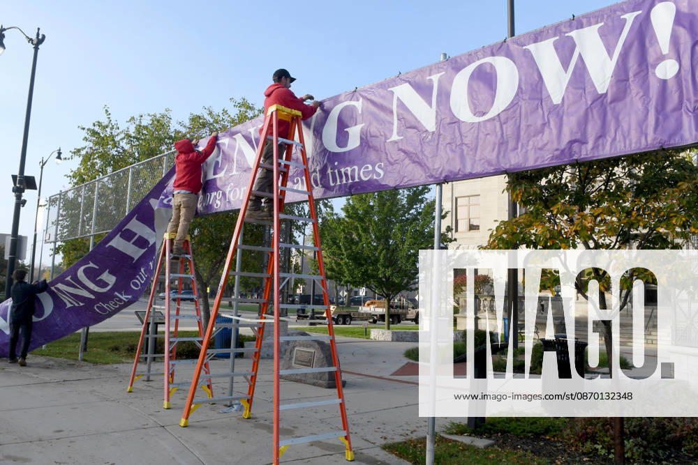 Workers put up a large banner announcing the start of voting as voters come to Racine City Hall Tuesday morning October 20, 2026 on the first day of early voting in Wisconsin for the midterm elections. There are two closely watched Congressional races, including the First District which includes Racine, and a contentious gubernatorial race on the ballot. Racine USA - ZUMAh154 20261020_znp_h154_003