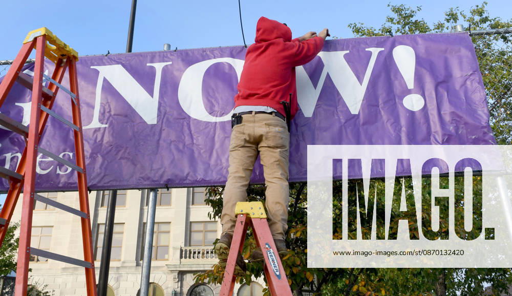 Workers put up a large banner announcing the start of voting as voters come to Racine City Hall Tuesday morning October 20, 2026 on the first day of early voting in Wisconsin for the midterm elections. There are two closely watched Congressional races, including the First District which includes Racine, and a contentious gubernatorial race on the ballot. Racine USA - ZUMAh154 20261020_znp_h154_002
