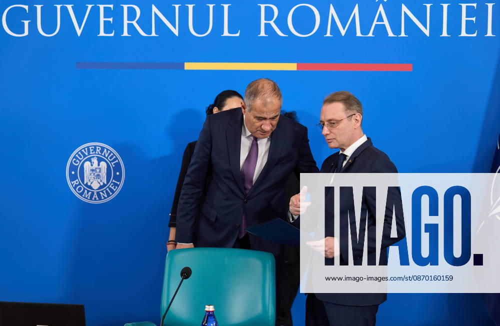 Bucharest, Romania. 20th Oct, 2026: Luca Niculescu (R), Prime Minister of Romania, speaks with Marian Neacsu (L), Deputy Prime Minister and Minister of Internal Affairs, during the government meeting at Victoria Palace, the Romanian Government headquarters. Bucharest Romania
