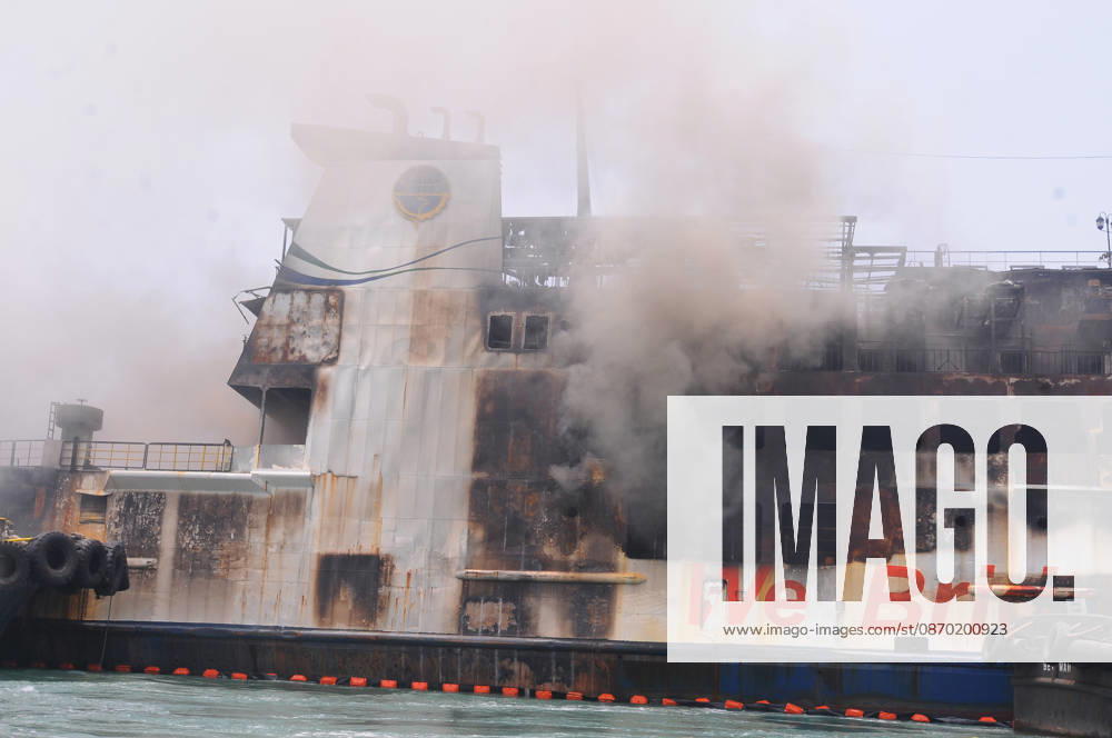 Efforts are underway to extinguish a fire that broke out on a passenger ferry in Indonesia s Cilegon PELABUHAN MERAK, CILEGON, INDONESIA - OCTOBER 21: Fireboats take turns spraying water onto the passenger ferry KMP Batumandi to cool down the vessel after it caught fire while preparing to dock off Merak Port in Cilegon, Banten, Indonesia on Wednesday, October 21, 2026. The vessel caught fire on Tuesday, October 20, and rescue operations remain underway as the ship continues to emit smoke. Water is continuously sprayed to cool the vehicle deck containing numerous cars, motorcycles, buses, and trucks, while authorities confirm no fatalities have been reported. Dasril Roszandi Anadolu Pelabuhan Merak Indonesia. Editorial use only. Please get