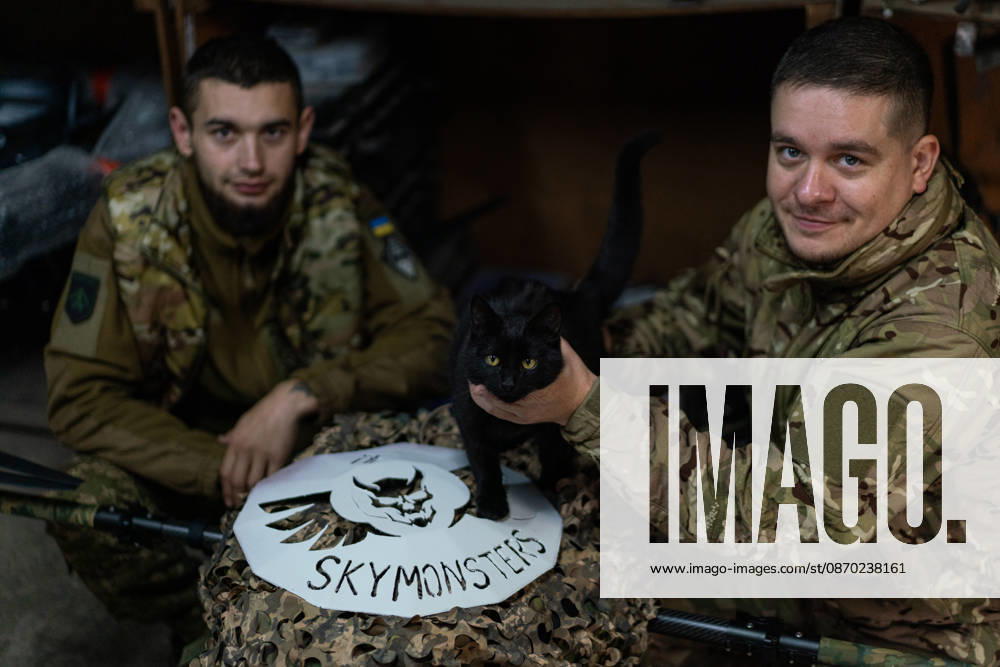 Ukrainian drone unit Skymonsters upgrades heavy UAVs in Kharkiv region KHARKIV REGION, UKRAINE - OCTOBER 21: Servicemen play with a cat as members of Skymonsters, the drone unit of the 13th Khartiia Brigade of Ukraine s National Guard, assemble, upgrade, and repair large unmanned aerial vehicles at an undisclosed location in Kharkiv region, Ukraine, on October 21, 2026. The drones, including Vampire models used for logistics missions and heavy bombers capable of carrying 13 to 20 kilograms of explosives, are prepared here before deployment to frontline positions. Carlo Bravo Anadolu Kharkiv Ukraine. Editorial use only. Please get in touch for any other usage.