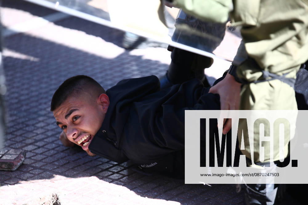 A student is restrained on the ground by police officers during a detention following minor clashes between students and riot police in Omonia Square. Athens GREECE - ZUMAx103 20261021_zip_x103_031