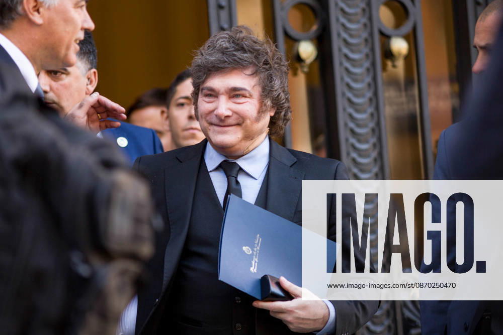 Javier Milei, President of Argentina visits Madrid - 21 Oct 2026 Javier Milei (C) President of Argentina, is seen leaving an informative breakfast briefing at the New Economy Forum in Madrid, where he is a featured guest. Madrid Spain
