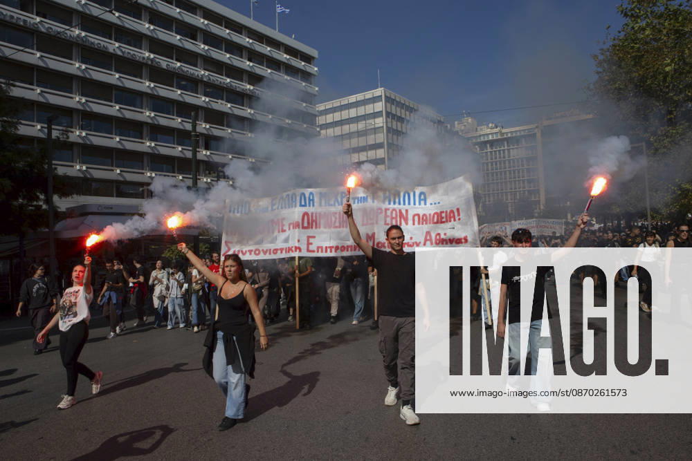 Athens Greece Living Costs Protest Protesters carry flares and a banner reading Free Public Education during a march in Athens, Greece on October 21, 2026. Students and other demonstrators marched through central Athens to protest rising living costs and economic pressures. Organizers say the concerns raised by participants echo grievances voiced during recent demonstrations in France. Athens Attica Greece