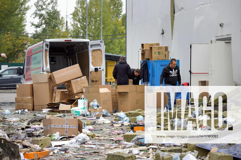 Men search for goods in a shopping area in the Obolonskyi district damaged by a Russian attack, Kyiv, Ukraine, October 22, 2026. On Thursday night, Russian forces struck the Ukrainian capital with ballistic missiles and drones. According to the Kyiv City Military Administration, six districts came under attack. One person was killed, 24 were injured, and 16 of them were hospitalised. (Photo by Marianna Kotyk Ukrinform) Russian attack destroys shops in Kyiv